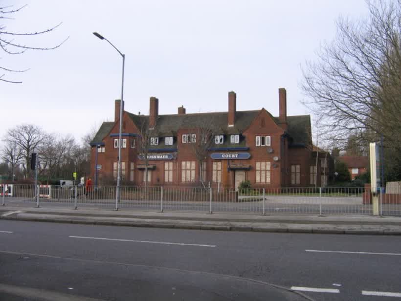 Derelict Crossways Court, ex The Crossways Pub. The Crossways pub was empty for some time before being converted into flats. They, in turn, are now derelict leaving a prominent building on a major crossroads looking an eyesore., close to the Aldi on College Road, Kingstanding