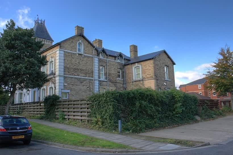 404 Marton Road Formerly named 'Erdely' this building was the birthplace of Ernest W. Hornung, brother-in-law to Sir Arthur Conan Doyle, friends with George Bernard Shaw and Oscar Wilde and an eminent author in his own right. Perhaps his most well known works are the Raffles stories. Raffles was a likeable gentlemanly rogue and have been made into a number of films: a silent movie in 1917 and later a remake in 1930. In 1939 David Niven played Raffles with Olivia de Havilland as his leading lady. Hornung's friendship with Oscar Wilde was close but became strained after Wilde was disgraced. Although Hornung's son was christened Oscar only days after Wilde was imprisoned. Ernest Hornung published under 'E.W. Hornung' and it is reported that a mix up with the initials on one occasion lead his friend Wilde to stress upon the importance of being Ernest. Whether this lead Wilde to a title for his most famous play is speculation. This photo is of the rear of the building taken from a small housing estate built on the former grounds of the house. The front aspect from Marton Road is now obscured by trees., close to the Aldi on Marton Road, Middlesbrough