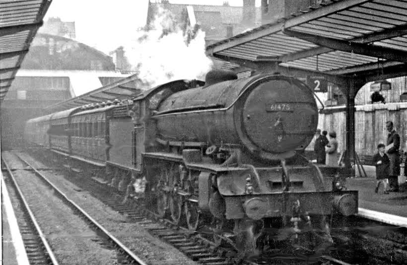 Sunderland station, with Newcastle - Middlesbrough express. View westward, towards Newcastle: ex-NER 'Coast' main line: Newcastle - Sunderland - West Hartlepool - Stockton and the South. The train is headed by a Gresley B16/2 rebuild (1/40) of a Raven B16/1 No.846 built 3/20, renumered in 1946 No. 1406, then 61475 in 1949 by BR, withdrawn 4/63. The station was badly damaged by enemy action in 1943 and was already re-roofed in 1953, rebuilt in 1965., close to the Aldi on St Mark's Road, Sunderland