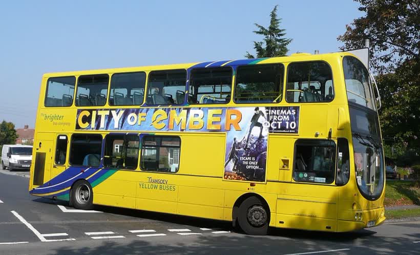 Transdev Yellow Buses 181 (HF03 ODV), a Volvo B7TL/Wright Eclipse Gemini, about to turn left from Edward Road into Somerford Road, Somerford, Christchurch, on route 1b. It has nearly reached its Somerford Sainsbury's terminus, where it will change into a 1c and return to Poole., close to the Aldi on Meteor Shopping Pk, Christchurch