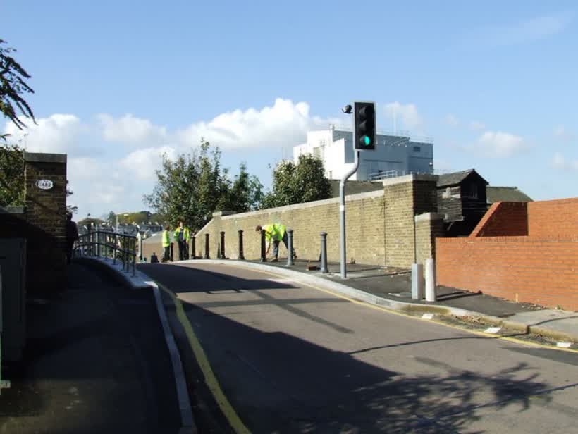 Railway bridge on Station Road Workmen are erecting new bollards., close to the Aldi on London Road, Bishop's Stortford
