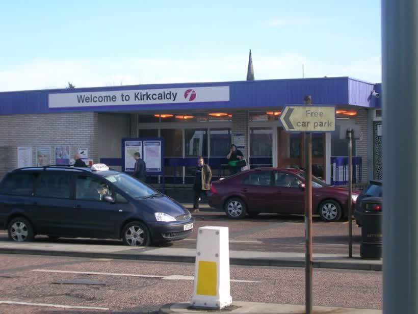 Kirkcaldy Railway Station (Whyte Melville Road/Forth Avenue entrance) This is the opposite side of the railway station, leading out onto the north platform for trains going to Dundee, Perth, Aberdeen, Inverness and beyond. This is situated on Whyte Melville Road/Forth Avenue off Oriel Road roundabout, in Kirkcaldy town centre. This building dates from 1964, surviving a fire that destroyed the main entrance. A car park, exists to the far left of the picture including a new extension with access just at Bennochy Bridge. The new extension is jam-packed with cars being left, for all of Kirkcaldy's commuters to go to work in Edinburgh., close to the Aldi on Ferrard Road, Kirkcaldy