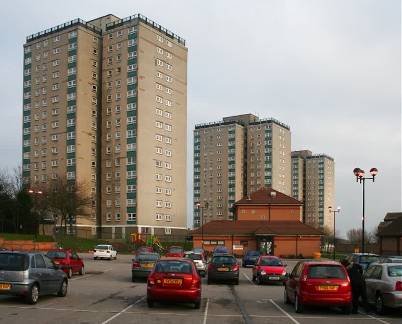 Multistorey Flats at Cornhill Some of the many large blocks which sprouted in Aberdeen in the 1960s. At the far side of the car park is a modern low-rise building, the Cairncry Community Centre. Its appearance is not enhanced by the untidy collection of scruffy posters inside the glass door., close to the Aldi on Cornhill Drive, Aberdeen