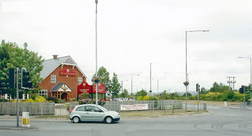Site of Gorseinon Station. View NW On A4240 High Street at Cockle Shell Inn, to station site opposite, towards Pontardulais, Llandilo etc.: ex-LNWR Central Wales line, Pontardulais - Swansea Victoria section, closed 15/6/64; since then 'Heart of Wales' trains have run from Llandilo to Swansea via Llanelli., close to the Aldi on Millers Drive, Gorseinon